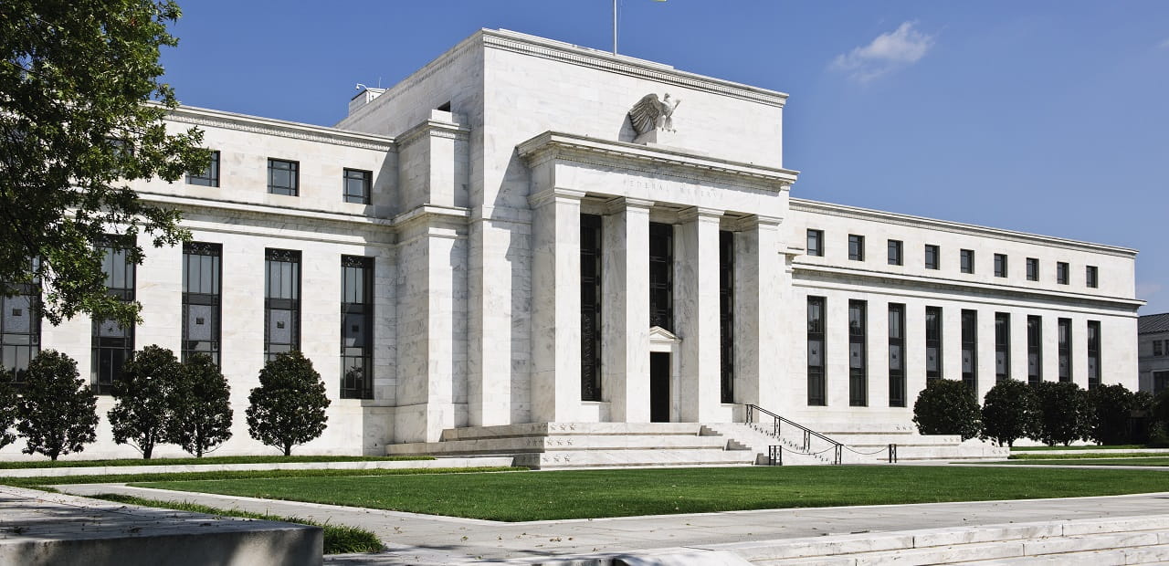 Federal Reserve sits at an angle with a tree appearing in the left-hand corner